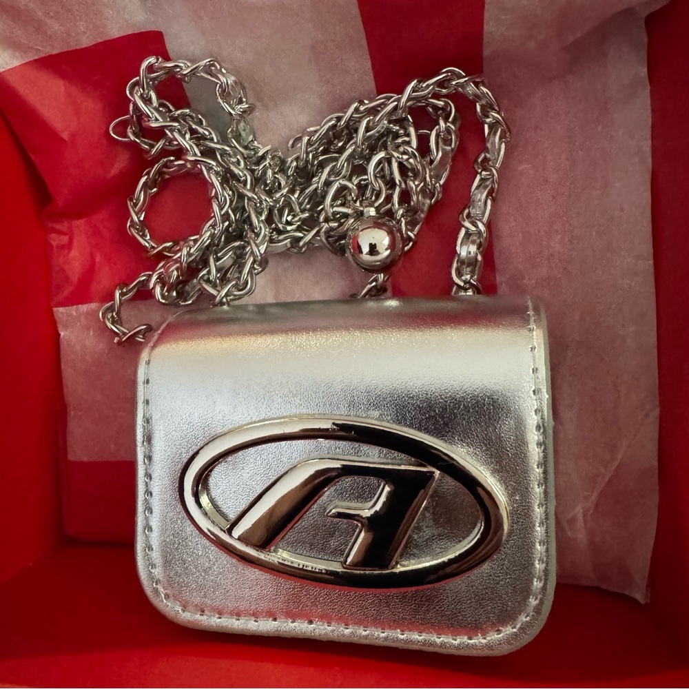 Metallic Silver Mini DIESEL bag , with a beautiful Diesel chain.